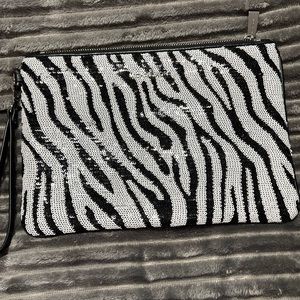 Michael Kors Wristlet.  Sequin zebra print.